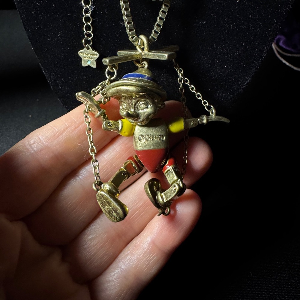 Gold and Red Pinocchio Pendant Necklace when you wish upon a star. Disney